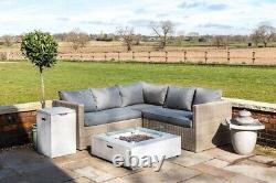 Table de chauffage extérieur en béton pour foyer au gaz dans le jardin, avec verre, roches de lave et housse.